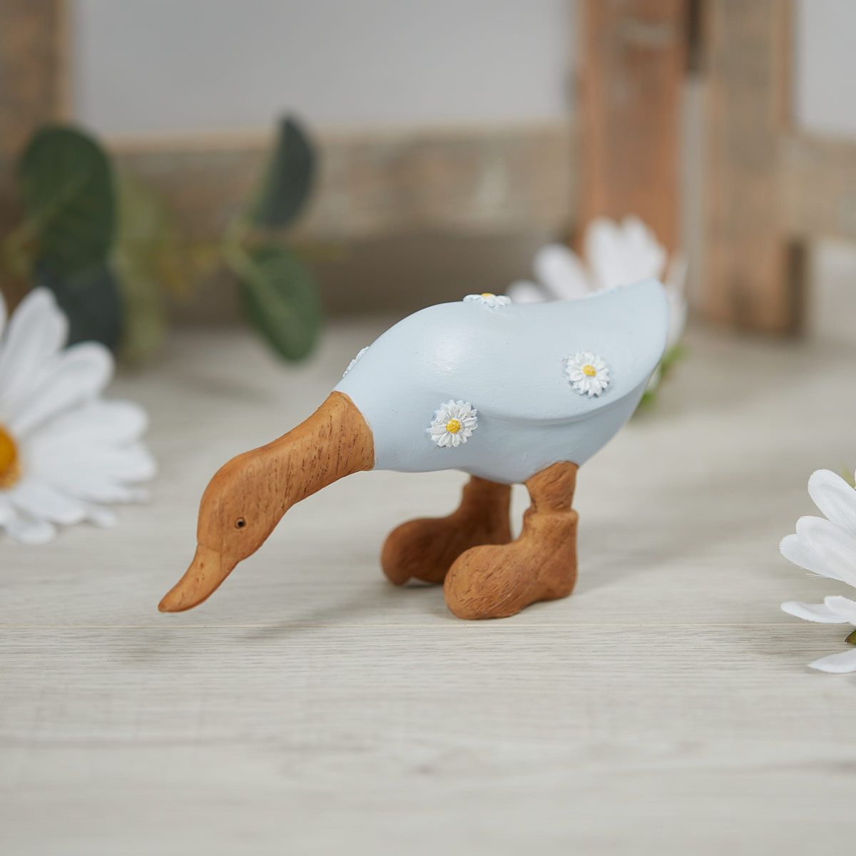 Leaning Duck Ornament with Daisies Wood Effect Resin - Blue