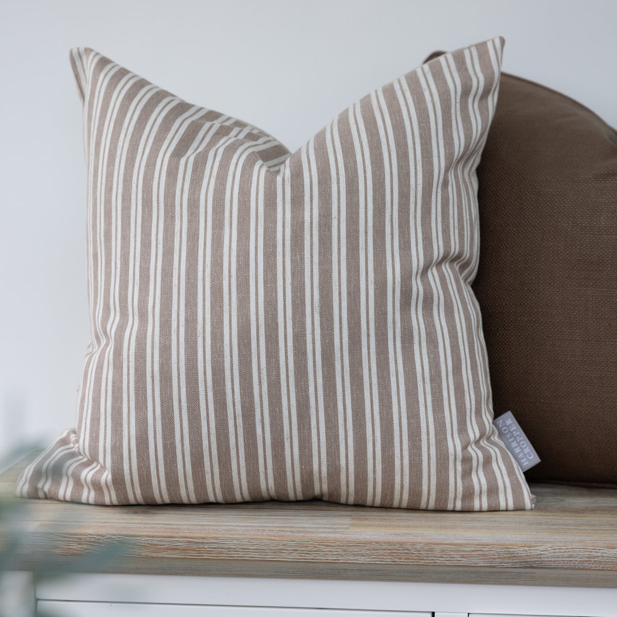 Alderton Hazelnut Brown Stripe Cushion with narrow cream stripes on a light brown background