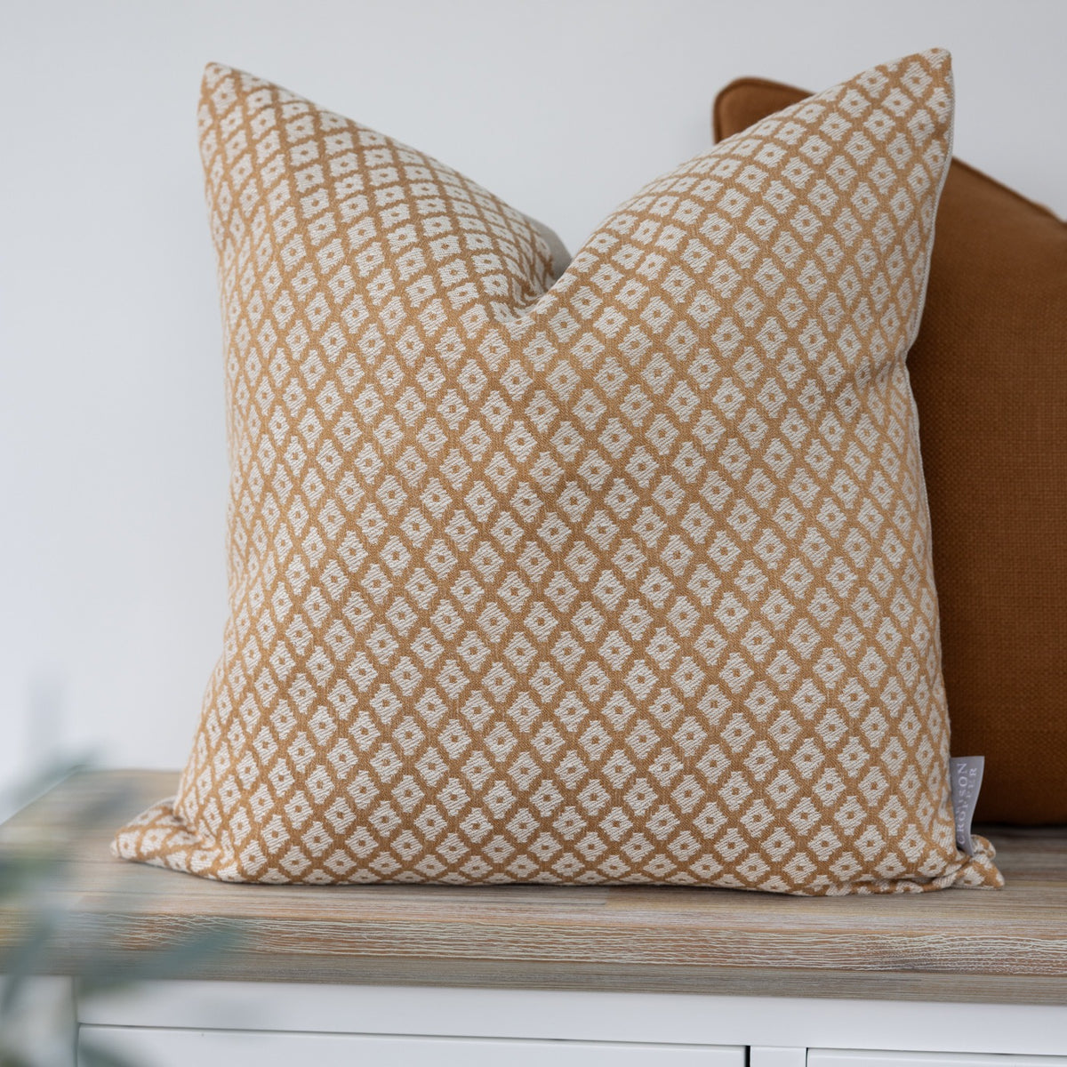 Elmstead Honey Geometric Cushion with small cream diamond motifs on honey