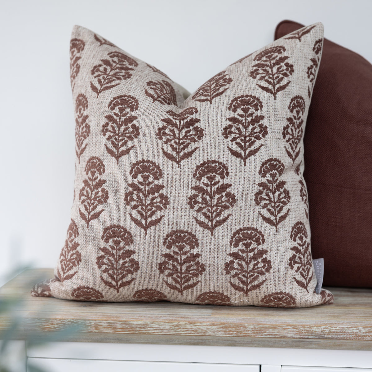 Hazelmere Auburn Floral Cushion with auburn floral motifs on a cream background