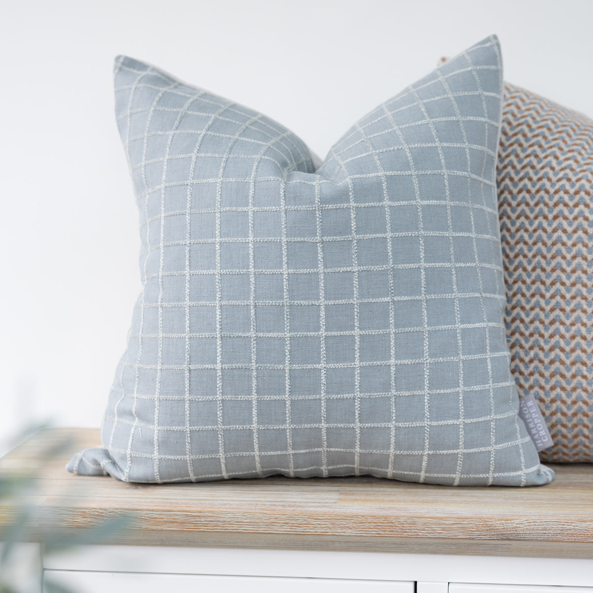 Whitmore Cornflower Blue Textured Check Cushion with a raised cream windowpane check