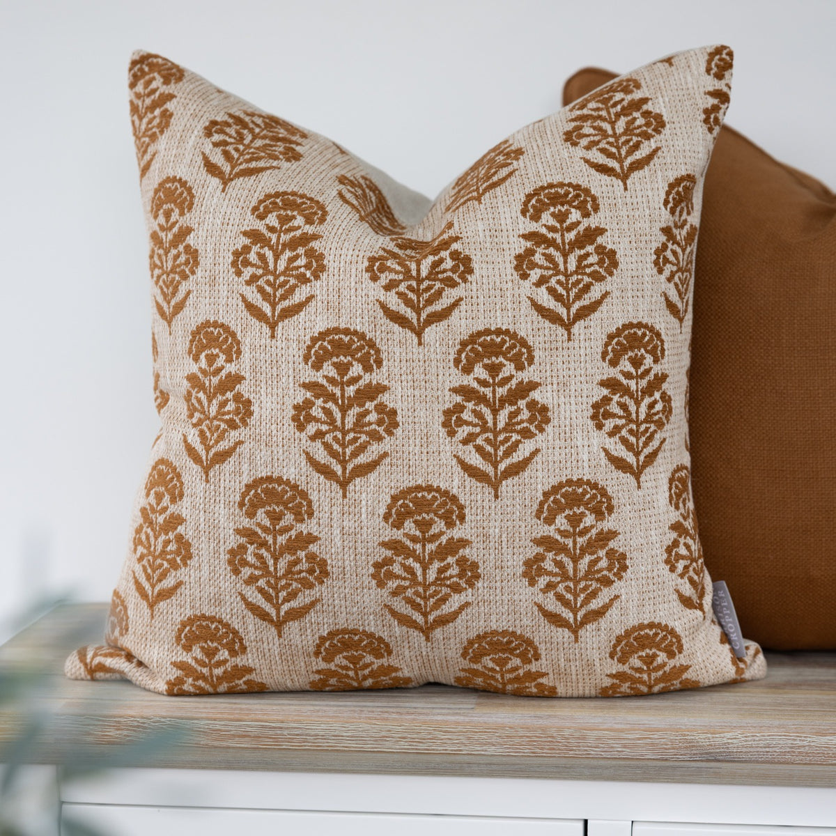 Hazelmere Ginger Floral Cushion with ginger floral motifs on a cream background