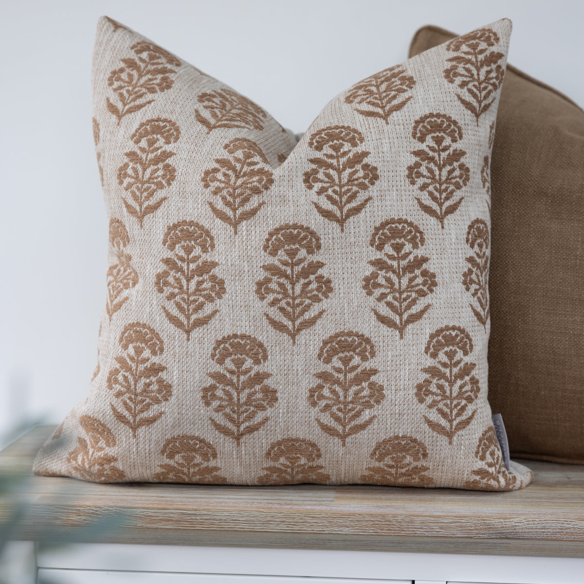 Hazelmere Hazelnut Brown Floral Cushion with light brown floral motifs on cream