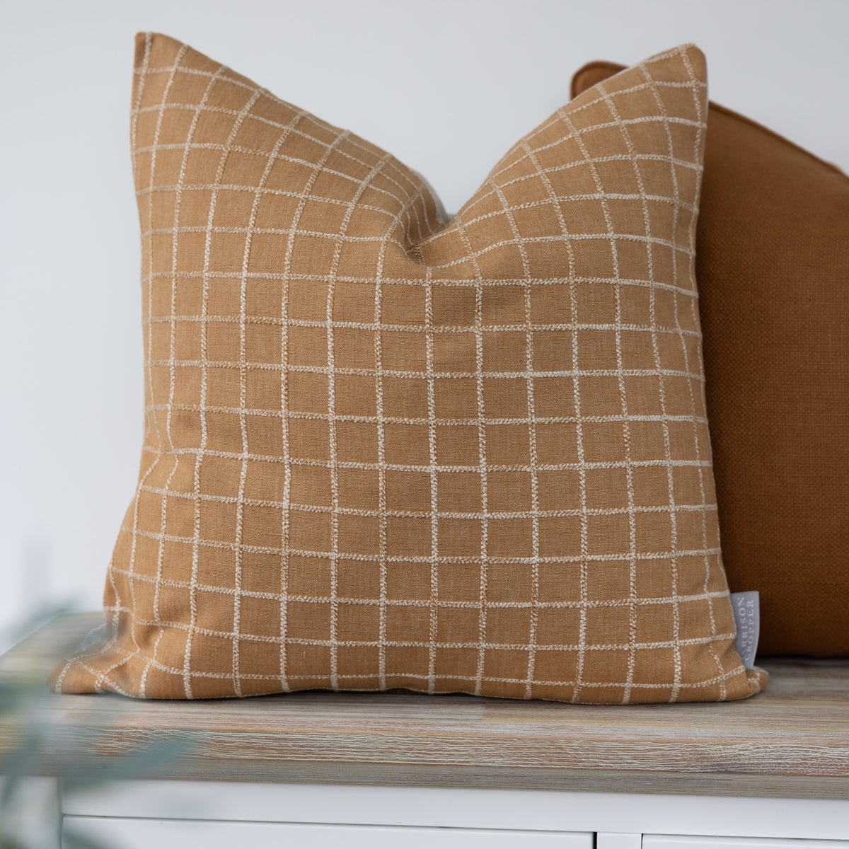 Whitmore Honey Textured Check Cushion with raised cream windowpane checks on a warm honey background